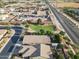 Aerial view of residential home next to green space and a commercial area at 41138 N Soap Berry St, Queen Creek, AZ 85140