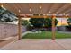 View from covered back patio to large landscaped back yard with storage area at 41138 N Soap Berry St, Queen Creek, AZ 85140
