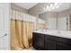 Bathroom features a double sink vanity and shower with a curtain at 41138 N Soap Berry St, Queen Creek, AZ 85140
