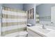 This cozy bathroom features a shower-tub combo with new fixtures and stylish decor at 41138 N Soap Berry St, Queen Creek, AZ 85140