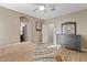 Bedroom features a large dresser, artwork and wood floors at 41138 N Soap Berry St, Queen Creek, AZ 85140