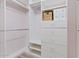 This walk in closet has hanging bars and drawers for plenty of storage at 41138 N Soap Berry St, Queen Creek, AZ 85140