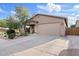 Charming single-story home featuring a well-maintained lawn, desert landscaping, and a two-car garage at 41138 N Soap Berry St, Queen Creek, AZ 85140