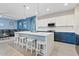 Bright kitchen offers seating around the island and views of the living room in an open floorplan at 41138 N Soap Berry St, Queen Creek, AZ 85140