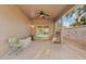 Covered patio with ceiling fan, concrete flooring, privacy screen, and furnishings at 41138 N Soap Berry St, Queen Creek, AZ 85140