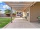 Covered patio with string lights, wood support beams, and a view of the spacious backyard at 41138 N Soap Berry St, Queen Creek, AZ 85140