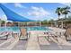 Inviting community pool area featuring comfortable lounge chairs, shaded seating, and a refreshing swimming pool at 41138 N Soap Berry St, Queen Creek, AZ 85140