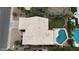 Aerial view of home with tile roof, backyard pool, covered patio, manicured lawn, and mature trees at 420 N Leoma Ln, Chandler, AZ 85225