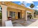 Inviting covered back porch with patio furniture perfect for outdoor relaxation and entertaining at 420 N Leoma Ln, Chandler, AZ 85225