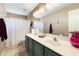 Bathroom features a double sink vanity, white countertops and a shower/tub at 420 N Leoma Ln, Chandler, AZ 85225