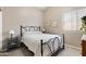 Cozy bedroom features a comfortable bed, side tables, and natural light from the window at 420 N Leoma Ln, Chandler, AZ 85225