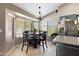 Sunlit dining area with large windows providing ample natural light and backyard views at 420 N Leoma Ln, Chandler, AZ 85225