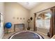 Bright exercise room with a vaulted ceiling, natural light, and space for workout equipment at 420 N Leoma Ln, Chandler, AZ 85225