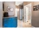 Inviting hallway featuring tile flooring, storage cabinet, and neutral paint at 420 N Leoma Ln, Chandler, AZ 85225