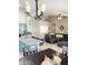 Open concept living area with kitchen island and a large sectional sofa, great for entertaining at 420 N Leoma Ln, Chandler, AZ 85225