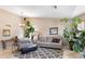 Bright living room featuring neutral walls, tile flooring, and large windows that fill the space with natural light at 420 N Leoma Ln, Chandler, AZ 85225