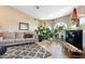 Bright living room featuring neutral walls, tile flooring, and large windows that fill the space with natural light at 420 N Leoma Ln, Chandler, AZ 85225