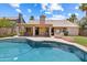 Sparkling backyard pool, covered patio and outdoor kitchen perfect for outdoor living and entertaining at 420 N Leoma Ln, Chandler, AZ 85225