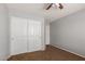 Bedroom with ceiling fan, closet, and carpet at 42347 W Bunker Dr, Maricopa, AZ 85138