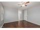 Bedroom includes ceiling fan and access to closet space and additional rooms at 42347 W Bunker Dr, Maricopa, AZ 85138