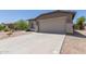 Charming single-story home with a two-car garage and a well-maintained front yard at 42347 W Bunker Dr, Maricopa, AZ 85138