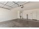 Spacious garage with water heater and overhead door at 42347 W Bunker Dr, Maricopa, AZ 85138