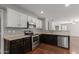 Stylish kitchen featuring stainless appliances, modern cabinetry, and plenty of counter space at 42347 W Bunker Dr, Maricopa, AZ 85138