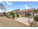 Outdoor patio area with gravel and a covered seating area perfect for entertaining friends and Gathering at 43787 W Colby Dr, Maricopa, AZ 85138