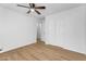 Neutral bedroom with tile flooring, ceiling fan, and large closet space at 43787 W Colby Dr, Maricopa, AZ 85138