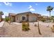 Charming single-story home featuring desert landscaping, a two-car garage, and a covered front porch at 43787 W Colby Dr, Maricopa, AZ 85138