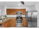 Well-equipped kitchen featuring granite countertops and stainless steel appliances at 43787 W Colby Dr, Maricopa, AZ 85138