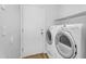 The laundry room includes modern washer and dryer and easy access to storage at 43787 W Colby Dr, Maricopa, AZ 85138