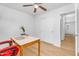 Home office featuring wood floors, neutral paint, and natural light at 43787 W Colby Dr, Maricopa, AZ 85138