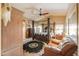 Spacious bedroom with canopy bed, leather sofa, and rustic furniture at 44890 W Desert Garden Rd, Maricopa, AZ 85139