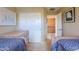 Shared bedroom boasts twin beds and decor at 44890 W Desert Garden Rd, Maricopa, AZ 85139