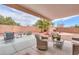 Cozy covered patio featuring comfortable seating, perfect for outdoor relaxation and entertaining at 44890 W Desert Garden Rd, Maricopa, AZ 85139