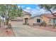 Charming two-story home featuring a three-car garage and desert landscaping at 44890 W Desert Garden Rd, Maricopa, AZ 85139