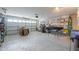 Spacious two-car garage with overhead door and ample room for vehicles and storage at 44890 W Desert Garden Rd, Maricopa, AZ 85139