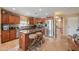 Spacious kitchen featuring an island, stainless steel appliances, and wooden cabinetry at 44890 W Desert Garden Rd, Maricopa, AZ 85139