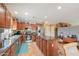 Well-lit kitchen boasting an island, stainless steel appliances, and ample cabinetry at 44890 W Desert Garden Rd, Maricopa, AZ 85139