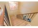 Carpeted staircase with a sturdy railing and a charming overhead light fixture at 44890 W Desert Garden Rd, Maricopa, AZ 85139