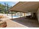 Backyard with covered patio, seating, pool, and desert landscaping at 510 N Entrada St, Chandler, AZ 85226