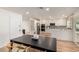 An open-concept dining area connected to a well-lit kitchen and featuring modern design at 510 N Entrada St, Chandler, AZ 85226