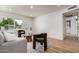Cozy living room with light colored wood flooring and views of the front yard at 510 N Entrada St, Chandler, AZ 85226