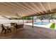 A covered patio featuring comfortable seating and views of the sparkling backyard pool at 510 N Entrada St, Chandler, AZ 85226