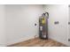 Bright utility room featuring a water heater and connections for laundry appliances at 510 N Entrada St, Chandler, AZ 85226