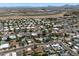 Bird's-eye view of a sprawling residential area with neatly arranged homes, pools, and desert landscaping at 6725 E Kings Ave, Scottsdale, AZ 85254
