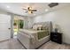 Comfortable bedroom with sliding glass doors to the backyard and neutral decor at 6725 E Kings Ave, Scottsdale, AZ 85254