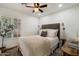 Comfortable bedroom featuring a ceiling fan and natural light from the shuttered window at 6725 E Kings Ave, Scottsdale, AZ 85254