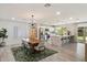 Open-concept dining and kitchen area with modern lighting and stainless steel appliances at 6725 E Kings Ave, Scottsdale, AZ 85254